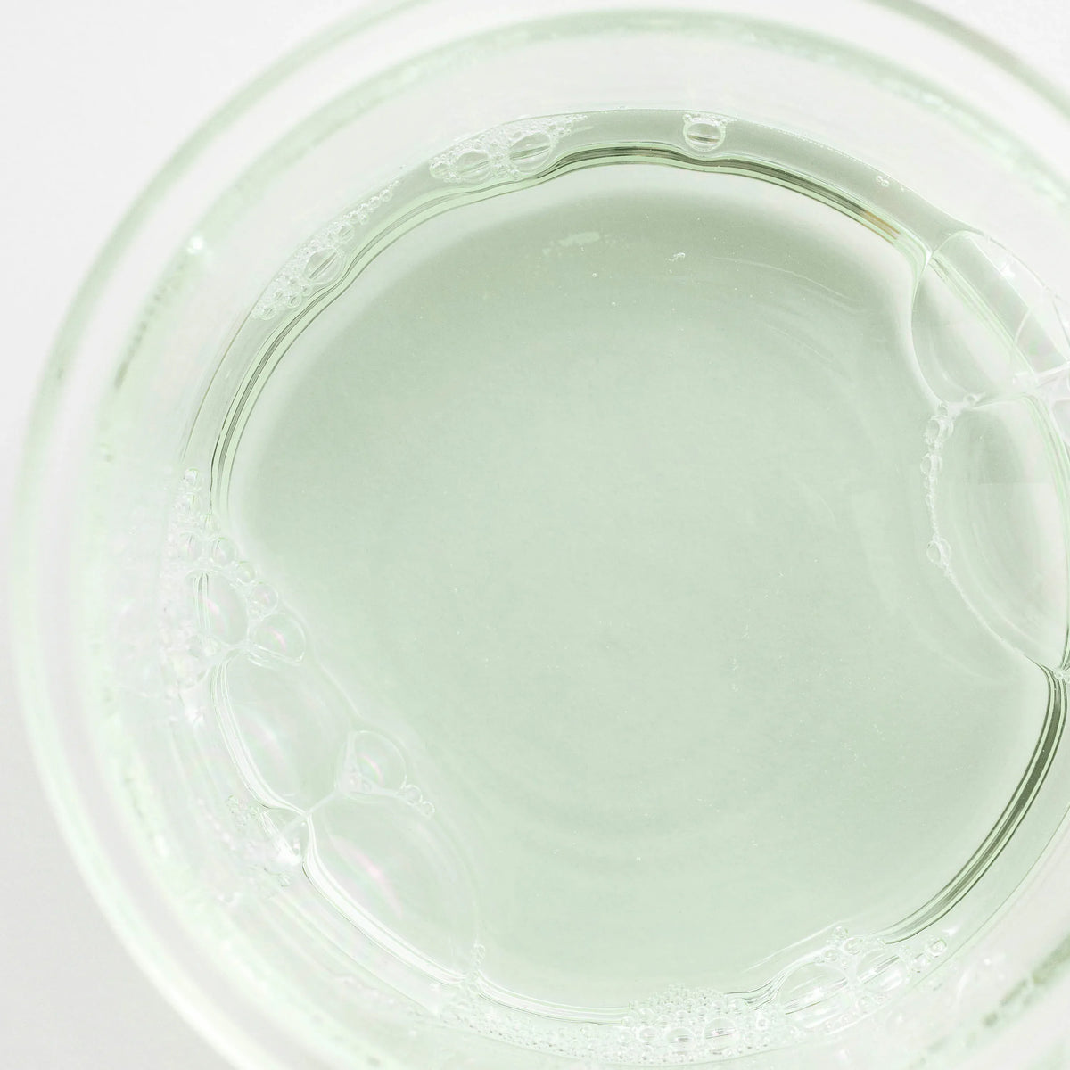 a clear glass with bubbles
